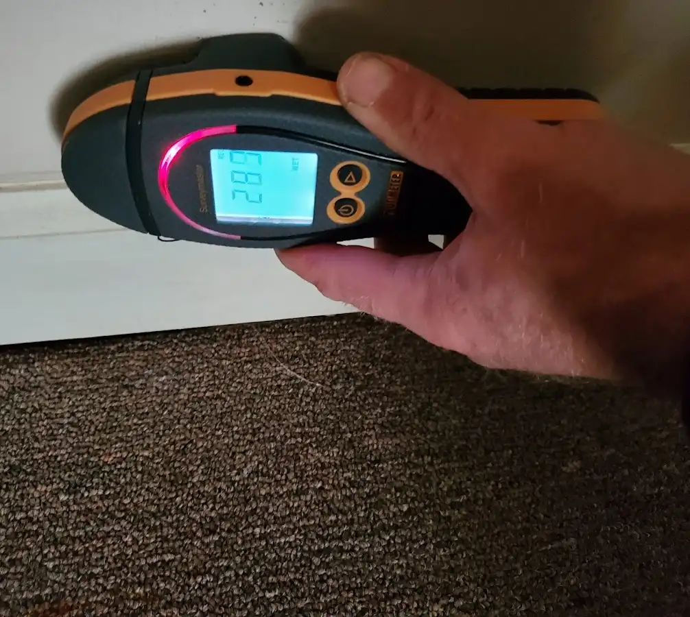Moisture detection at baseboard during Storm Damage Restoration in Stamford